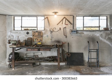 Old Workbench With Old Work Tools In Home Garage