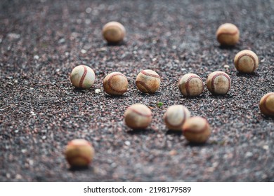 Old, Worn Baseballs On High School Baseball Field