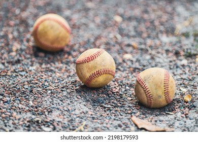 Old, Worn Baseballs On High School Baseball Field