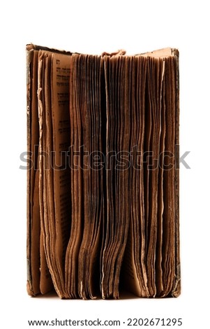 Old worn book pages isolated on white. Torah. Selective focus. No text. Vertical orientation. Closeup