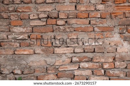 old and worn brick wall without plaster.