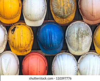 Old and worn colorful construction helmets - Powered by Shutterstock