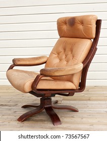 Old Worn And Dirty Brown Leather Recliner Chair