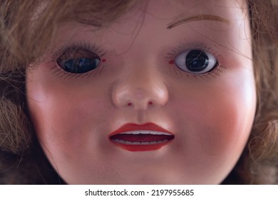 An Old Worn Doll With Dirty Face Close Up. Macro.