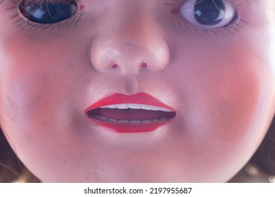 An Old Worn Doll With Dirty Face Close Up. Macro.