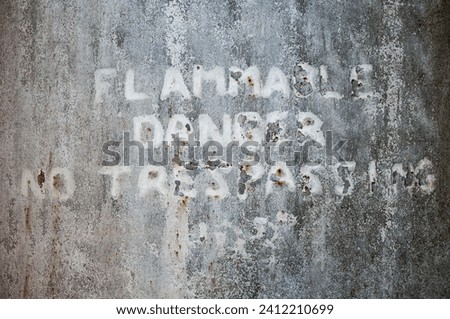 An Old Worn Flammable Danger No Trespassing Sign