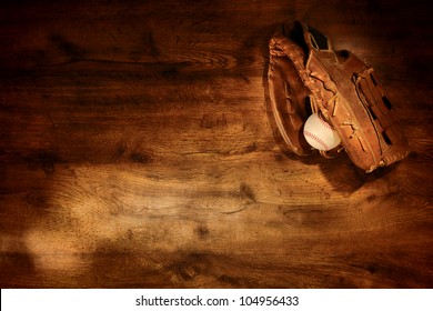 Old Worn Leather Baseball Glove And Used Ball On Nostalgic Americana Sport Wood Plank Background