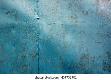 Old Worn Metal Surface With Paint. Rusty Metal Texture. Metal Sheet With Rust And Worn Paint. Background. Metal. Wall. Floor.