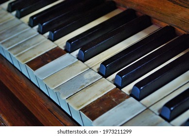 Old Worn Out Piano Close Up Of Missing Keys