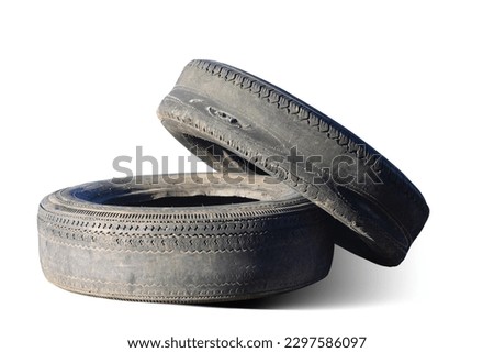 old worn out tire next to another old tire isolated on white background as sample of damaged tires from some tires