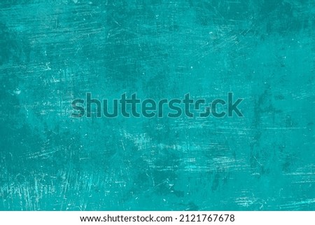 Old worn out turquoise colored metal sheet background, grunge texture 