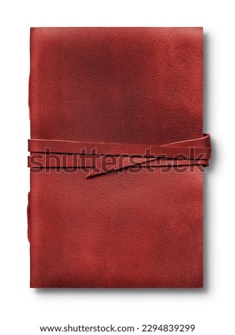 Old worn red leather notebook isolated on white background, closed with a band