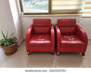 Old and worn red sofa - Shutterstock ID 2265535701