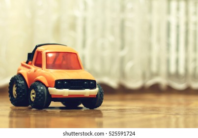 Old Worn Toy Car In The House