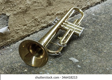 Old Worn Trumpet Stands Alone In Alleyway Behind A Jazz Club
