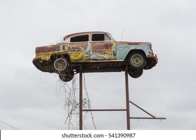 Old Wrecked Car On Posts As Roadside Attraction, South Carolina, USA