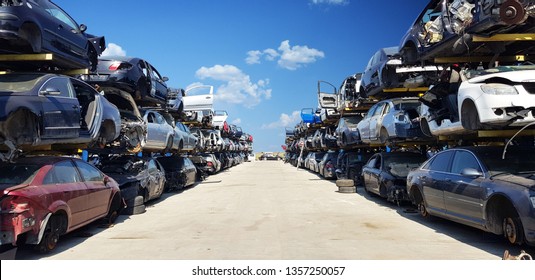 Old wrecked cars in junkyard waiting to be shredded in a recycling park
 - Shutterstock ID 1357250057