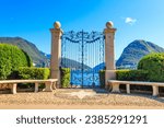 Old wrought iron gate overlooking Lake Lugano in Ciani Park, Lugano, Switzerland