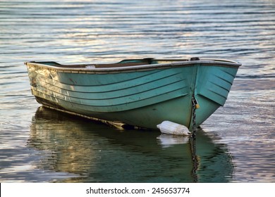  Old Yawl Boat Floating On The Lake At Sunset 