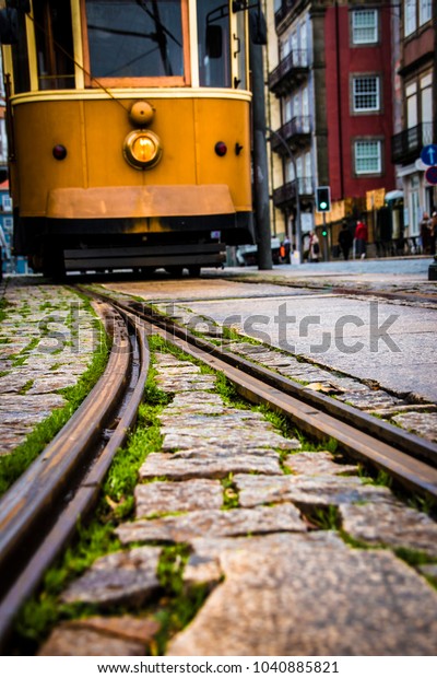 Old yellow city\
tram and tramway close-up