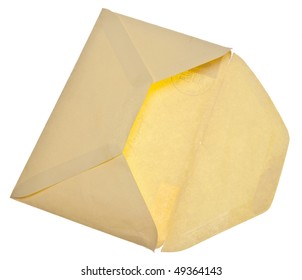 Old Yellow Envelope Lit From Above And Below So You Can See The Stamp And Post Mark Through The Paper.  Isolated On White With A Clipping Path.