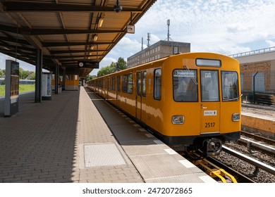 Old yellow underground train of the city of Berlin. Underground train at the station. - Powered by Shutterstock