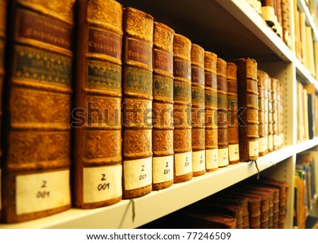 old yellow vintage books in library showing education concept