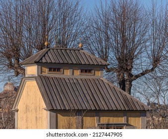 Old Yellow Wood House With Wood Roof And A Dorm A Sunny Winter Day In Stockholm, Sweden 2022-02-18