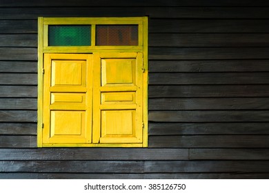 Old Yellow Wood Window On Wood Wall.