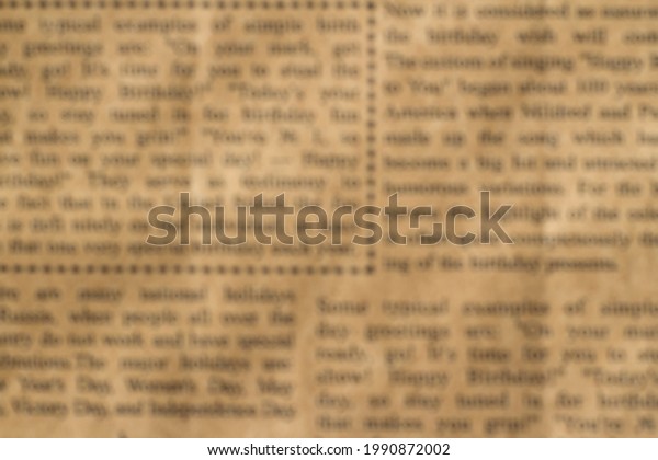 Old,\
yellow, wrinkled newspaper with printed, blurry text close-up for\
texture and background. The text is divided into columns, some of\
the lines are highlighted with a dotted\
frame