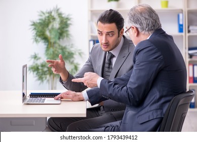 Old And Young Businessmen In Business Meeting Concept