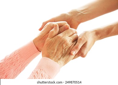 Old And Young Holding Hands, Isolated On White