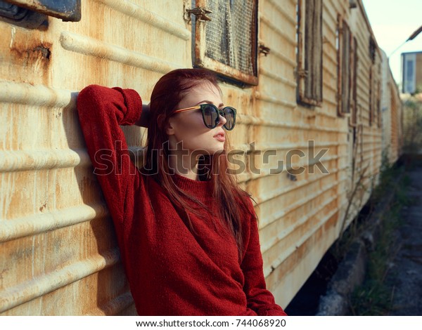 old young woman in glasses is standing by the\
van, style, fashion