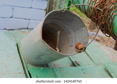 Old Zinc Bucket On A Rustic Well