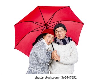 Older asian couple under umbrella on white background - Powered by Shutterstock