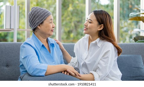 Older Asian Woman Patient Covered The Head With Clothes Effect From Chemo Treatment In Cancer Cure Process Hold Hands Of Daughter With Happiness.