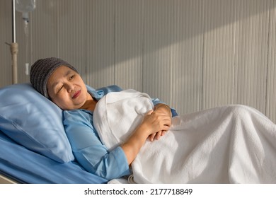 Older Asian Woman Patient Covered The Head With Clothes Effect From Chemo Treatment In Cancer Cure Process Laying On Hospital Bed With Suffer And Lonely.