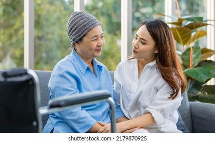 Older Asian Woman Patient Covered The Head With Clothes Effect From Chemo Treatment In Cancer Cure Process Hold Hands Of Daughter With Happiness.