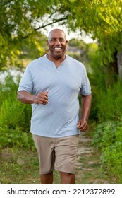 Older Black Man Walking On A Trail.