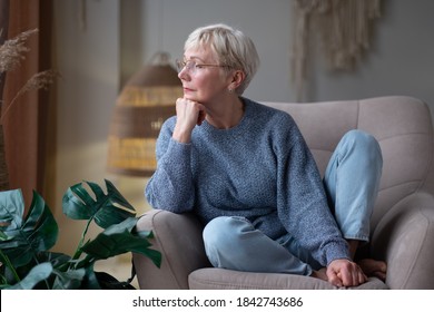 Older caucasian woman resting seated on coach, enjoy summer day. No stress, free time, serene calm person - Powered by Shutterstock