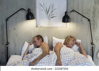 Older Couple In Bed Angry