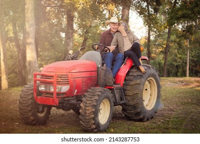 Older Couple Cuddling On A Tractor