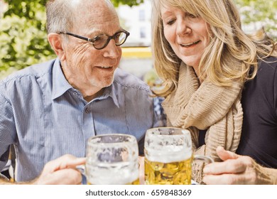 Older couple drinking beer together