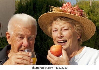 Older Couple Eating Apple