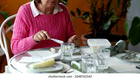 Older Couple Eating Lunch Together, Candid Authentic Real Life Senior Couple At Home Balcony