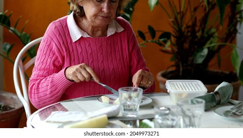 Older Couple Eating Lunch Together, Candid Authentic Real Life Senior Couple At Home Balcony