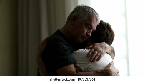 Older couple embrace, senior emocional intimacy. middle aged husband hugging and caring for wife
