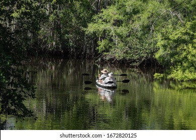 Older Couple Enjoy Canoeing At Jonathan Dickenson State Park, Hobe Sound, Florida