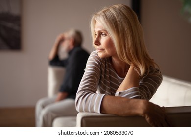 The older couple has a conflict. Upset mature woman, quarrel with her husband. Relationship crisis.