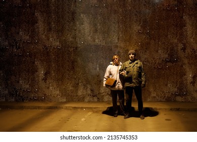 Older Couple Hiding From War In A Underground Shelter